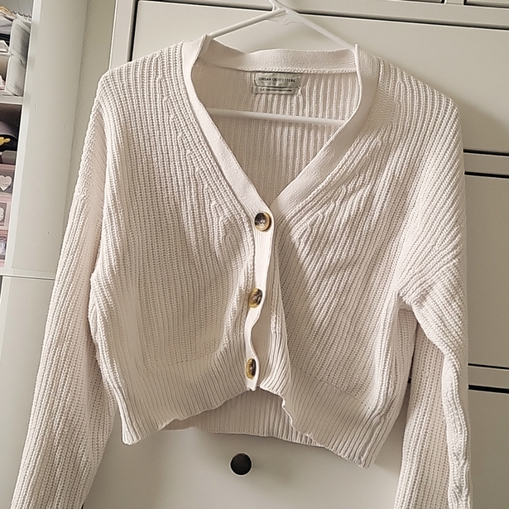 A small white knit cardigan from urban outfitters.